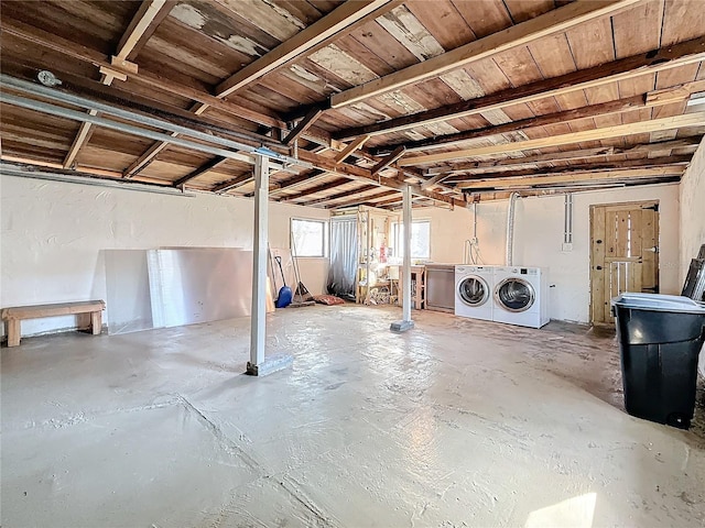 basement with washer and clothes dryer