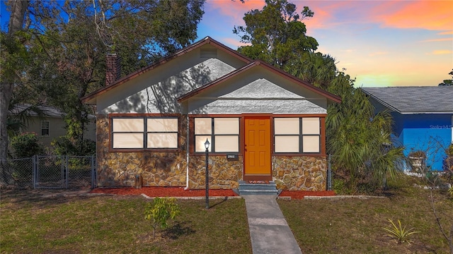 view of front of home with a lawn