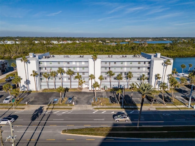 birds eye view of property with a water view