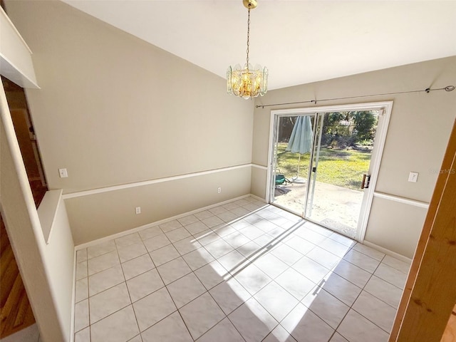 unfurnished dining area with an inviting chandelier and light tile patterned flooring