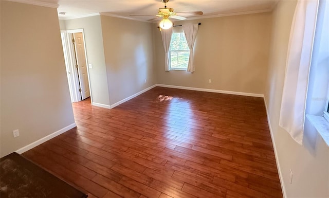 unfurnished room with dark hardwood / wood-style flooring, crown molding, and ceiling fan