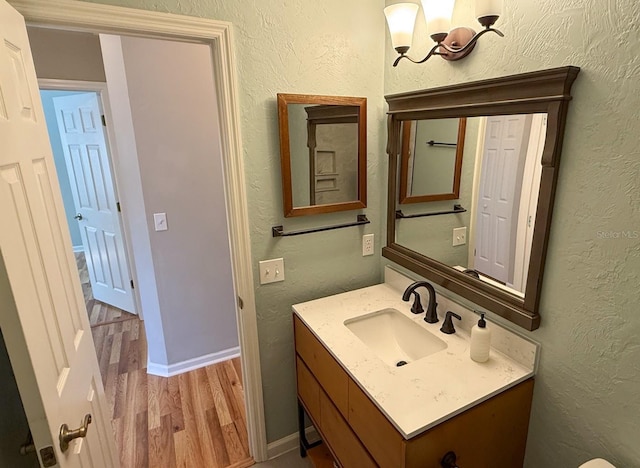 bathroom featuring vanity and hardwood / wood-style flooring