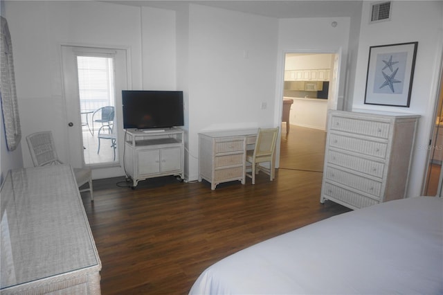 bedroom featuring dark hardwood / wood-style flooring