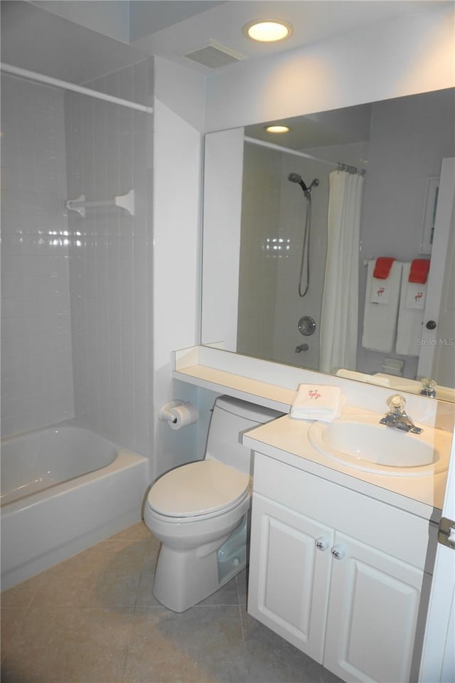 full bathroom with shower / bathtub combination with curtain, tile patterned floors, toilet, and vanity