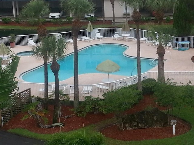 view of swimming pool featuring a patio