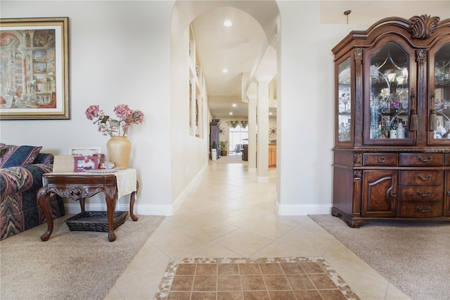 hallway featuring light tile patterned floors