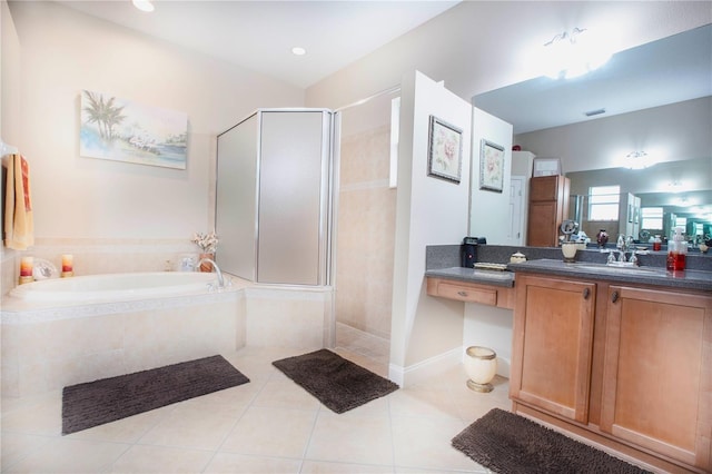 bathroom featuring vanity, independent shower and bath, and tile patterned flooring