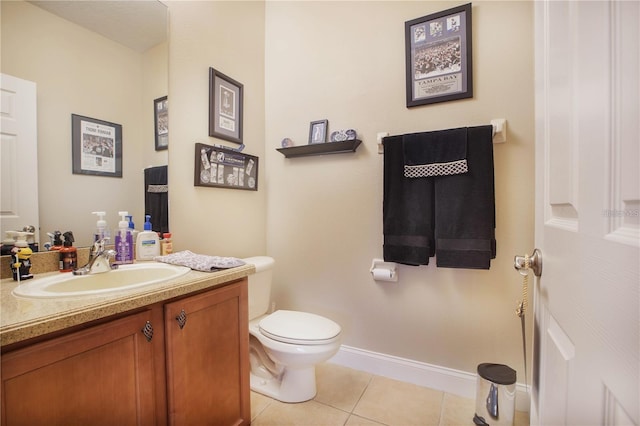 bathroom featuring tile patterned floors, toilet, and vanity