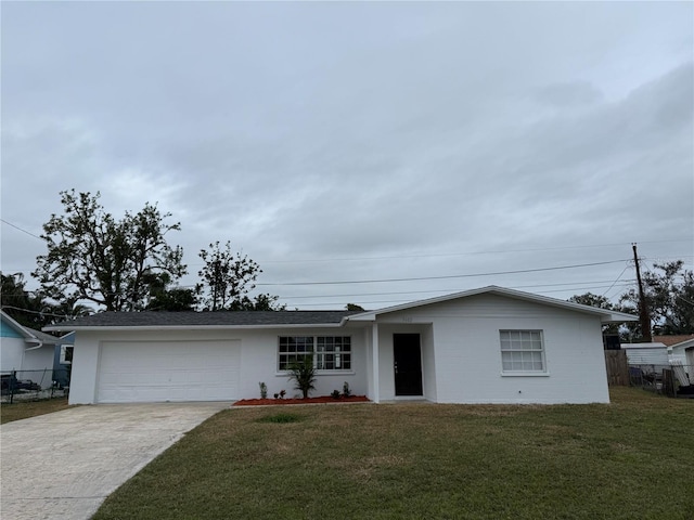 ranch-style house with a garage and a front yard