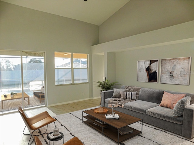 living room featuring high vaulted ceiling