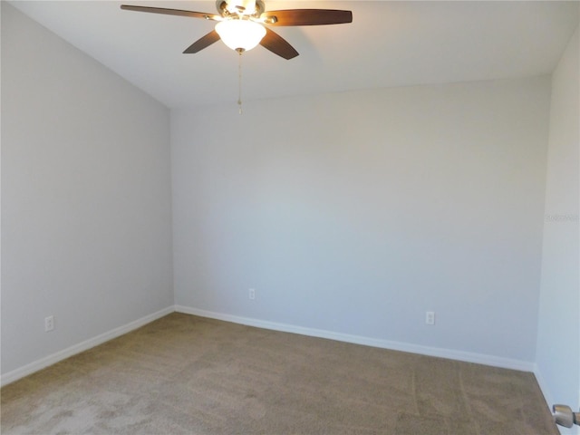 spare room with ceiling fan and carpet flooring