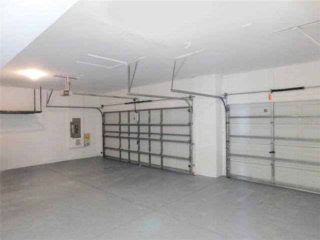 garage featuring a garage door opener and electric panel