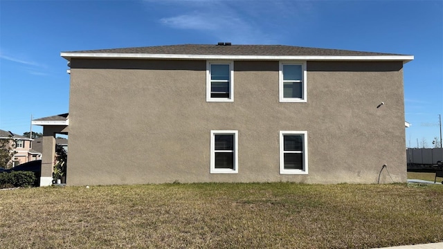 view of side of property featuring a yard