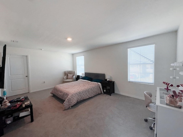 bedroom featuring light carpet