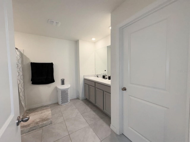 bathroom with tile patterned floors and vanity