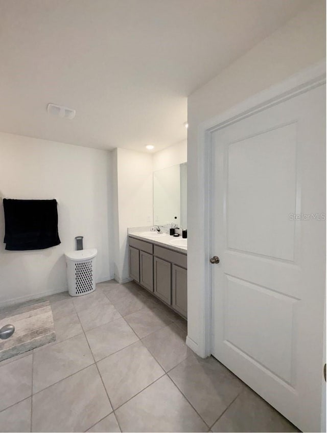 bathroom with tile patterned floors and vanity