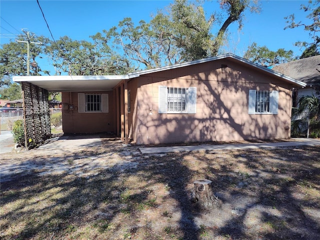 view of front of property with a carport