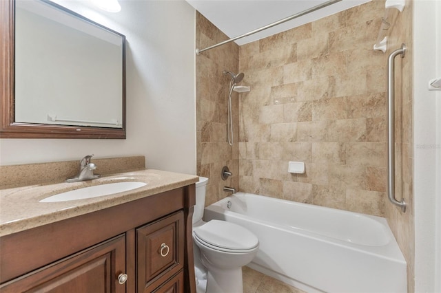 full bathroom with vanity, tile patterned floors, toilet, and tiled shower / bath