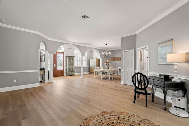 office with crown molding, a chandelier, and light wood-type flooring