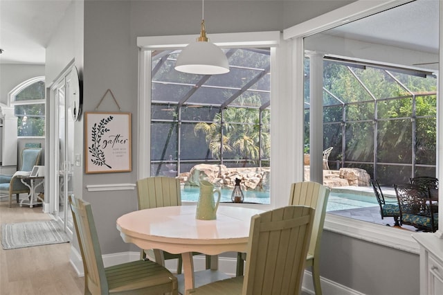 dining space featuring wood-type flooring