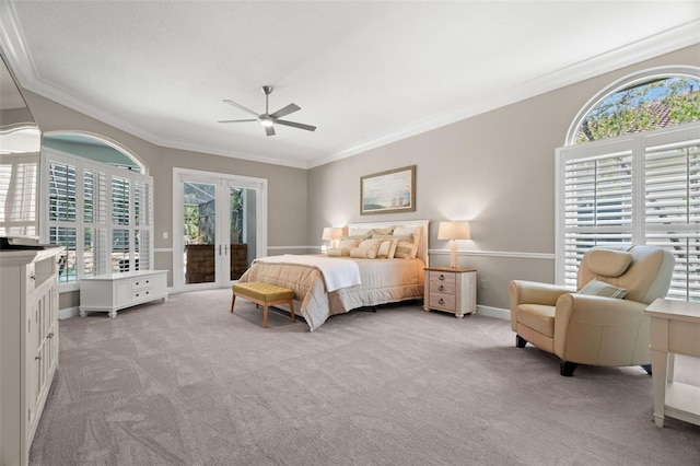 carpeted bedroom with multiple windows, crown molding, access to outside, and french doors