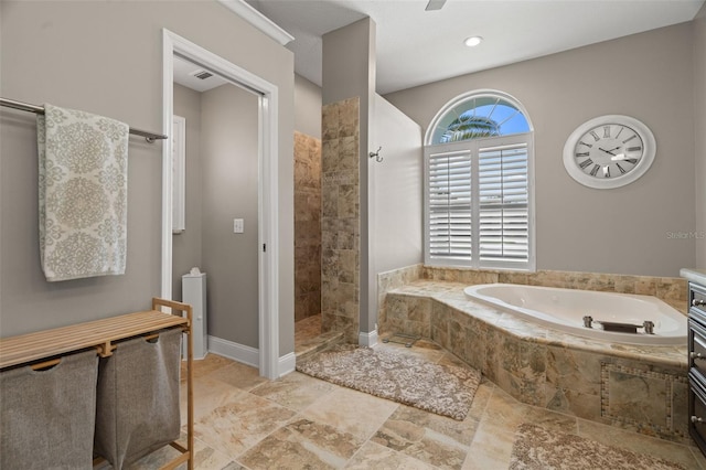 bathroom with independent shower and bath and ceiling fan