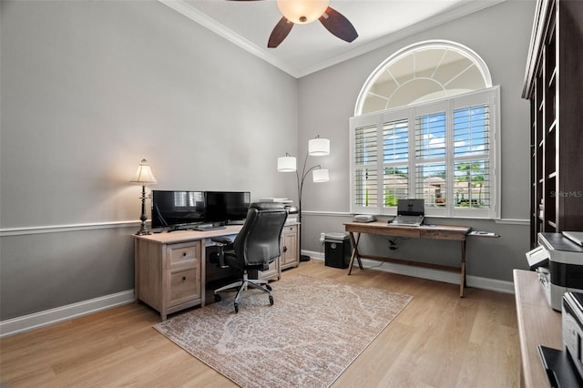 home office featuring light hardwood / wood-style flooring, ornamental molding, and ceiling fan