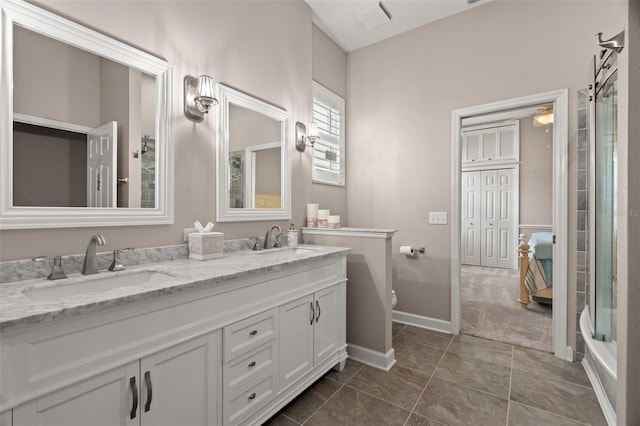 full bathroom with vanity, toilet, and combined bath / shower with glass door