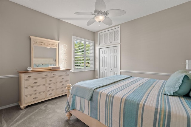 bedroom with carpet, ceiling fan, and a closet