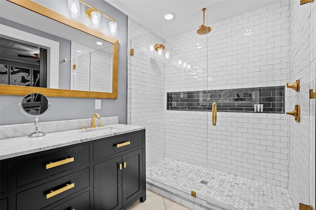 bathroom featuring vanity, tile patterned floors, and a shower with door