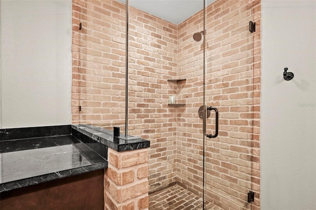 bathroom with a shower with shower door