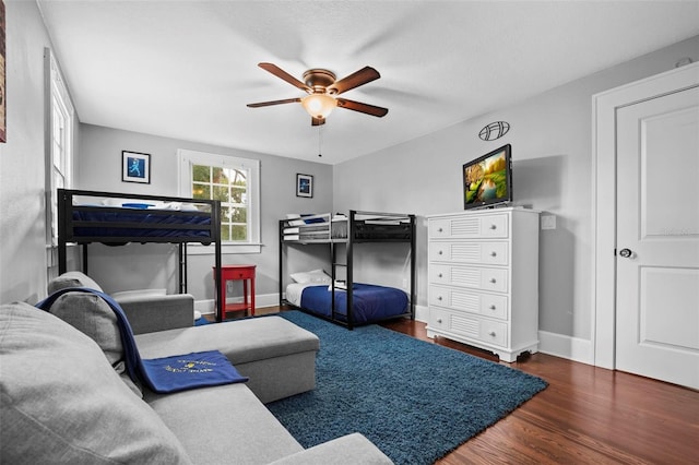 bedroom featuring dark hardwood / wood-style flooring and ceiling fan