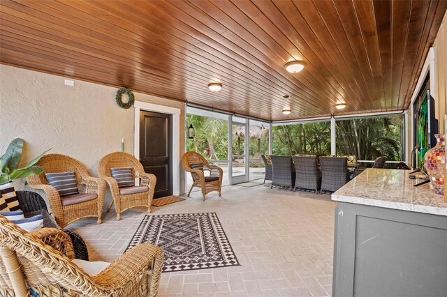 sunroom with wood ceiling