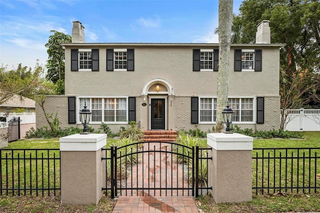 colonial home with a front yard