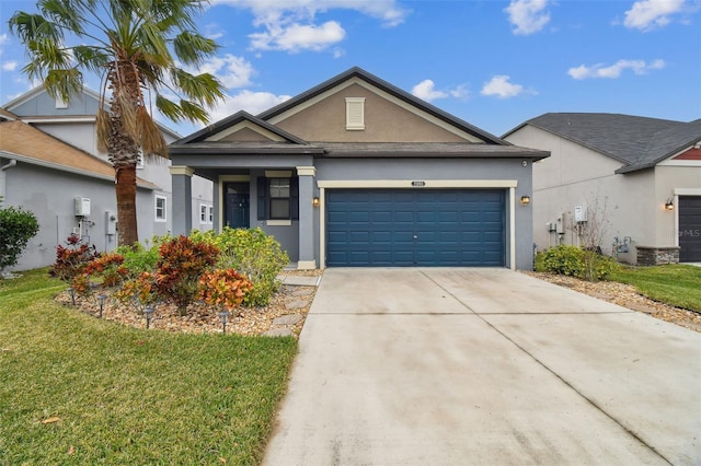 view of front of home with a garage and a front lawn