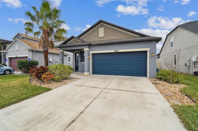 view of front of property featuring a garage and a front lawn