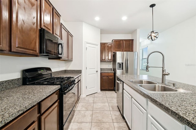 kitchen featuring sink, white cabinets, light tile patterned floors, dark brown cabinetry, and black appliances