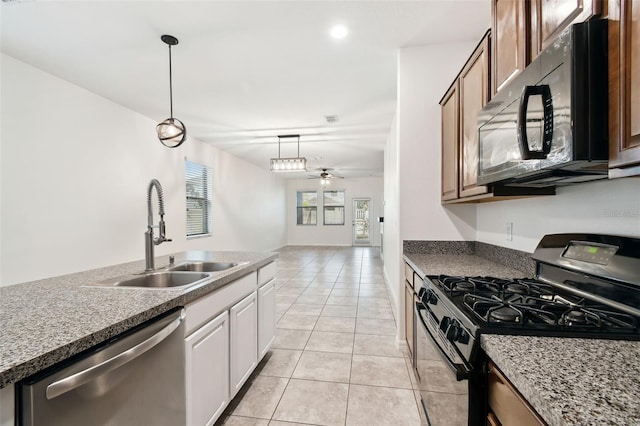 kitchen with pendant lighting, sink, white cabinets, ceiling fan, and black appliances