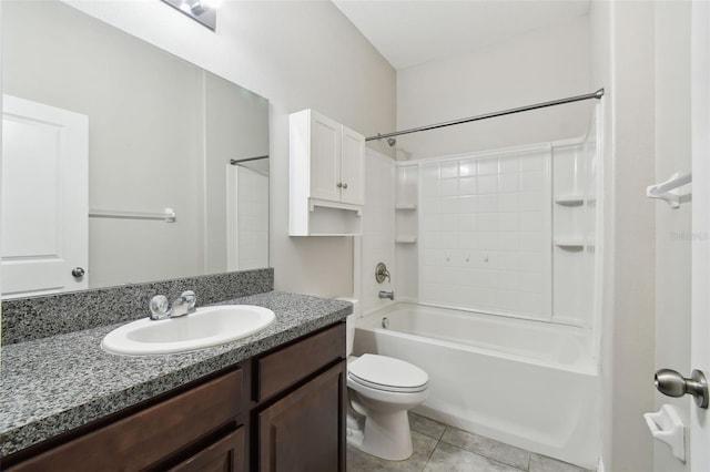 full bathroom featuring tile patterned floors, toilet, bathing tub / shower combination, and vanity