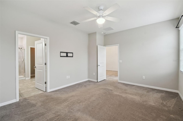 unfurnished bedroom featuring ceiling fan and light colored carpet