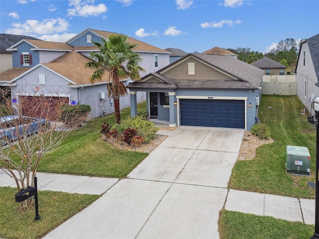 view of front of property with a garage and a front lawn