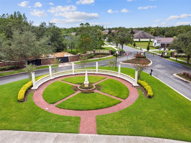 view of property's community featuring a yard