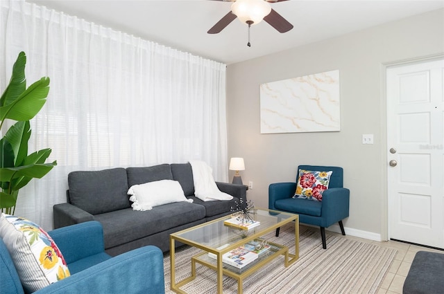 living room featuring light tile patterned floors and ceiling fan