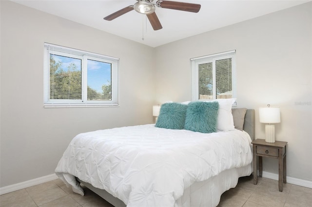 tiled bedroom with ceiling fan