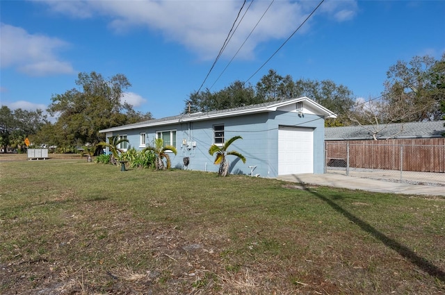 garage with a lawn