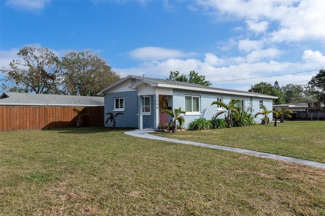 single story home with a front lawn