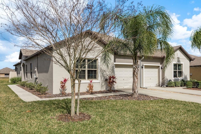 view of front facade featuring a garage and a front lawn