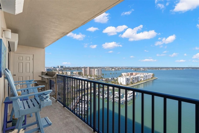 balcony featuring a water view