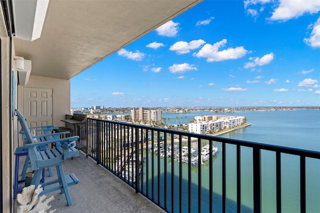 balcony featuring a water view