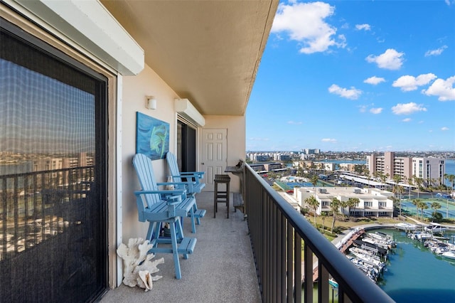 balcony featuring a water view